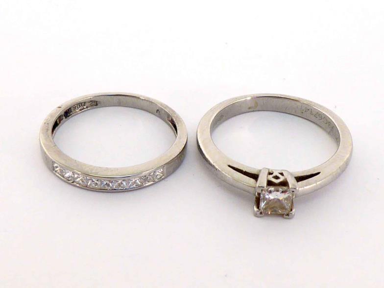 Two platinum and diamond rings, the first single stone princess cut 0.27 carat, the shank fully