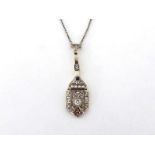 An Art Deco diamond pendant, circa 1920, the plaque drop set to the centre with a 0.10 carat old cut