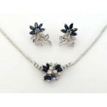 A sapphire and diamond necklace and earring suite, the necklace with a central spray of marquise cut