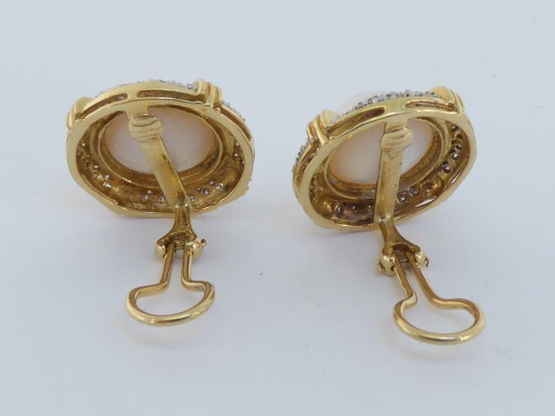 A pair of diamond and mabe pearl earrings, the central pearl 13mm diameter, in a surround of pave - Image 2 of 2