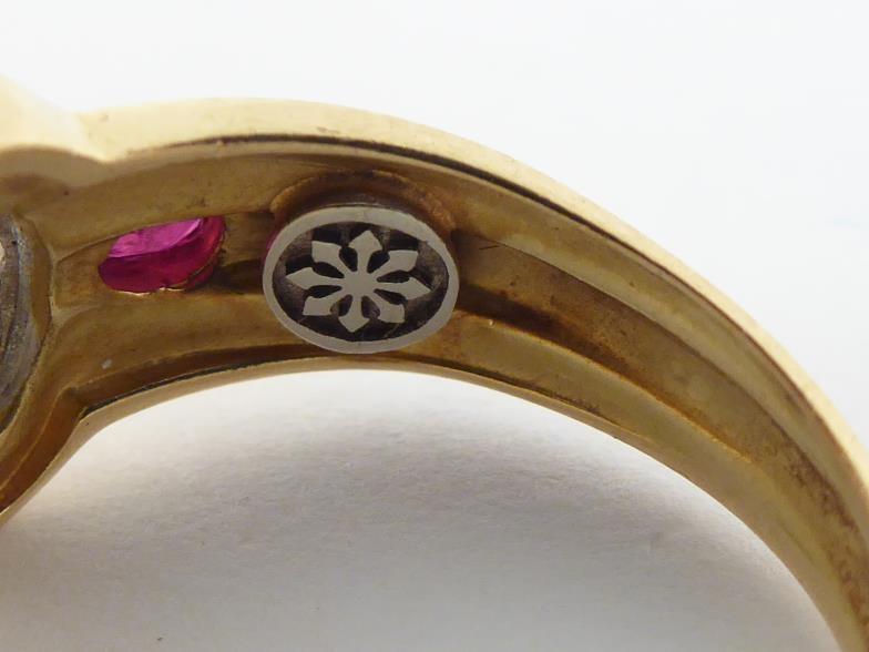A French 18 carat gold, diamond and ruby ring, with a central pave set oval of small brilliants, - Image 3 of 4