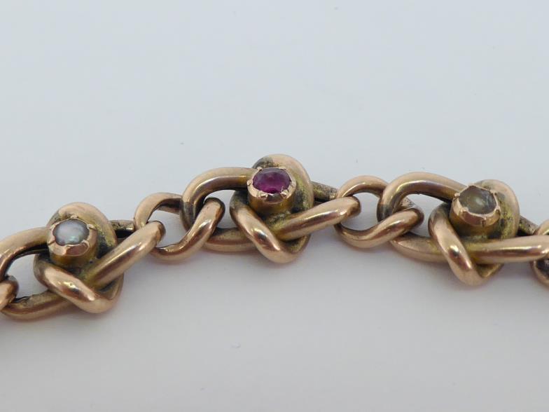 A 9 carat gold split pearl and ruby curb link bracelet, to a heart shaped padlock clasp, fully - Image 3 of 4