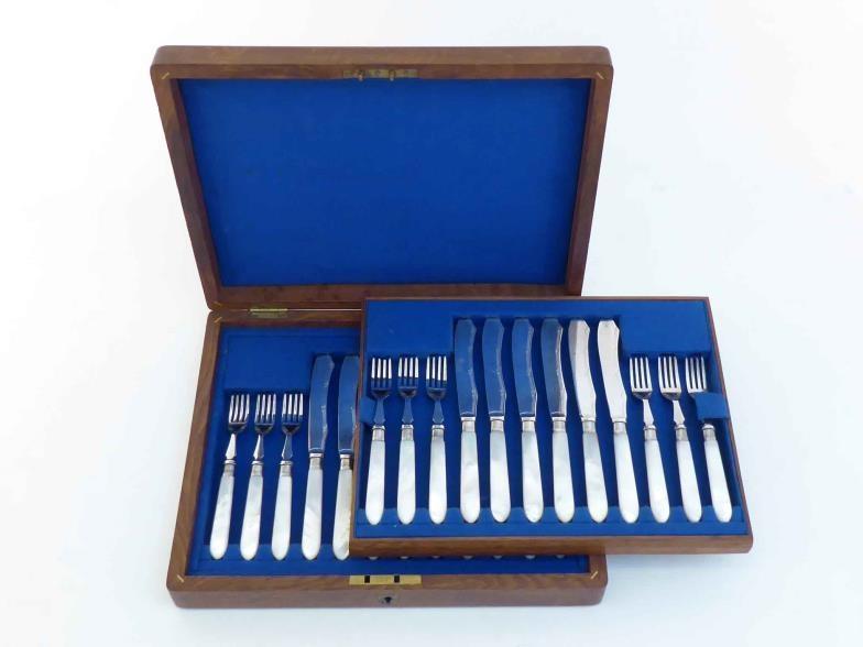 Twelve pairs of silver plated fruit knives and forks with mother-of-pearl handles and silver