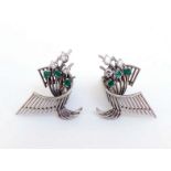 A pair of 1950s emerald and diamond ear clips, of a stylised spray design, each set with three small
