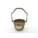 A German silver sugar basket with Austrian import mark for 1901/21, circular with tall fixed