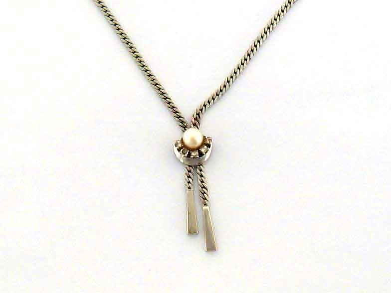 A cultured pearl and diamond necklace, the drop composed of a 7.1mm pearl above a skirt of five claw