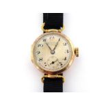 A 1920s lady's 14 carat gold manual wind wristwatch, the circular three piece case with stirrup