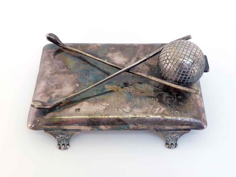 Golfing interest:-A silver-plated novelty inkstand, the well formed as a golf ball behind two