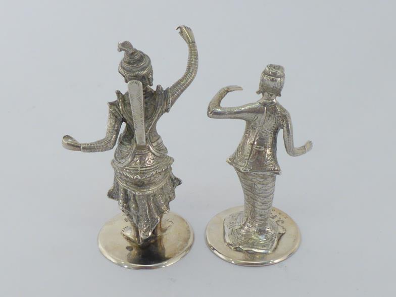 A pair of Burmese cast silver figural menu-holders, circa 1907, one modelled as a temple dancer - Image 4 of 4