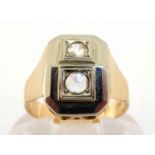 A diamond ring, the rectangular sloped bezel set with two rose cut stones, mounted in white metal,