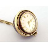 Borel, a gilt metal and enamel orb pendant watch, the burgundy enamel circular swivel case painted