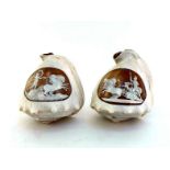 A pair of conch shells cameo-carved with Apollo on a quadriga drawn by four horses, the other Aurora