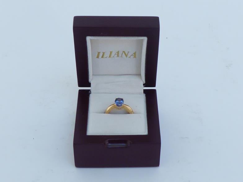 An 18 carat gold and tanzanite ring, the central oval cut stone approx. 2 carats, the shank fully - Image 6 of 6