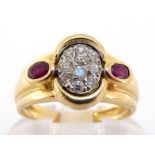 A French 18 carat gold, diamond and ruby ring, with a central pave set oval of small brilliants,