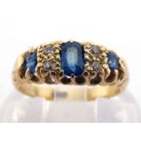 An early 20th century sapphire and diamond ring, set with three graduated oval cut sapphires,