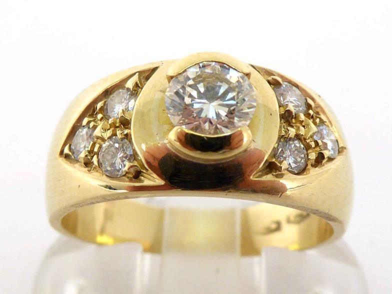 A diamond dress ring, the central brilliant approx. 0.40 carat, a trefoil of brilliants to each