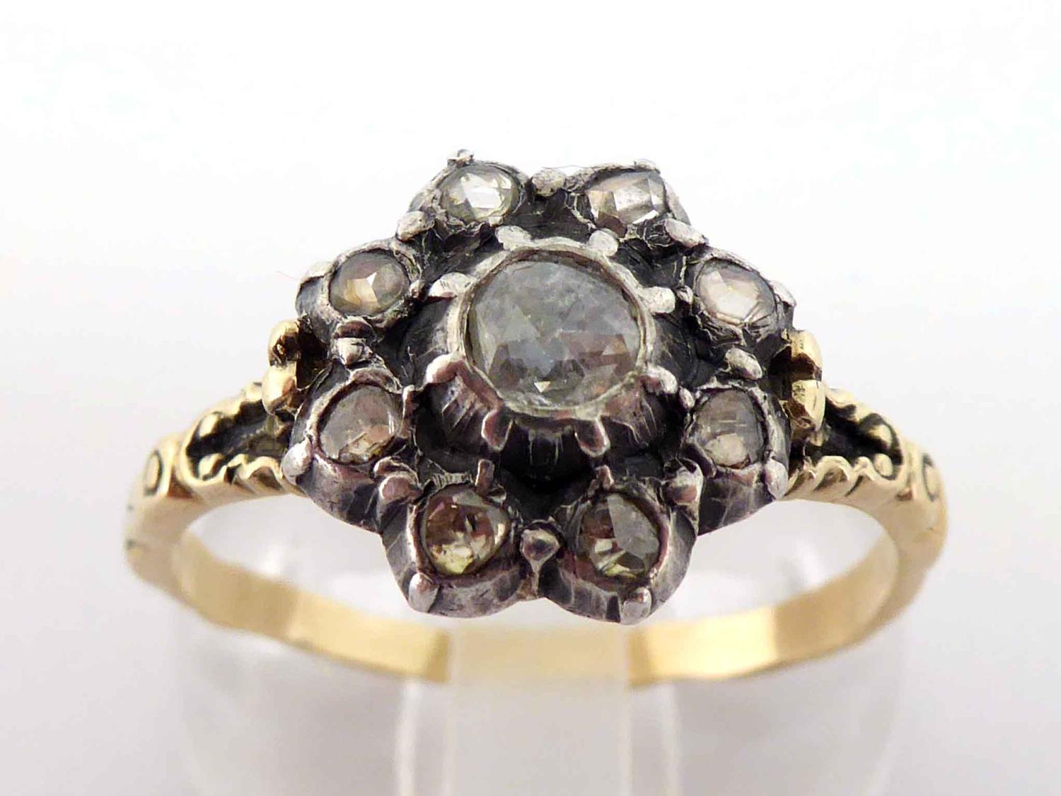 A 19th century diamond cluster ring, the central rose cut 3.8mm diameter, in a surround of smaller