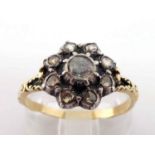 A 19th century diamond cluster ring, the central rose cut 3.8mm diameter, in a surround of smaller