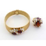 An opal, garnet and diamond bracelet, the central foliate cluster composed of two large oval cut