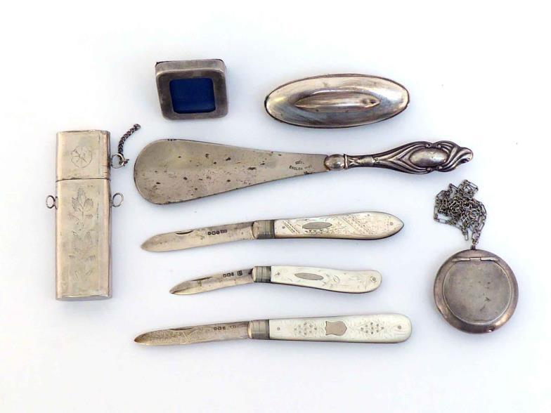 A group of small silver items comprising:- three silver-bladed folding fruit knives with pique-