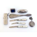 A group of small silver items comprising:- three silver-bladed folding fruit knives with pique-