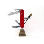 A VIctorinox shop display model Swiss army Knife, the blades electrically powered to open and shut