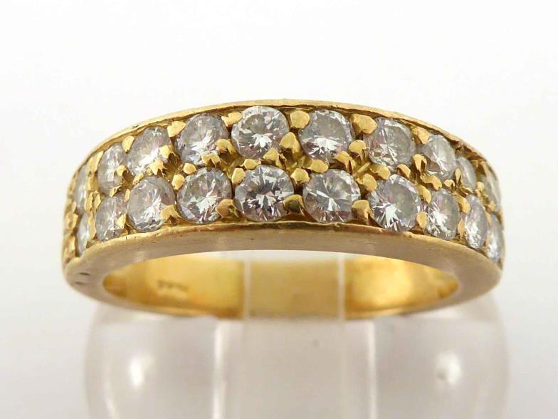 A diamond band ring, composed of two rows of brilliants, totalling approx. 0.90 carat, mounted in