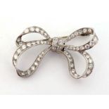 A diamond bow brooch, set overall with brilliants and single cuts, mounted in white gold (pin