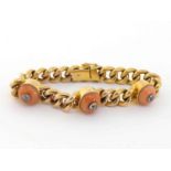 A late Victorian 15 carat gold, coral and diamond bracelet, the curb link chain set along its length