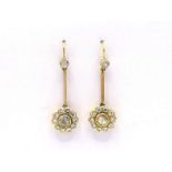 A pair of diamond earrings, the cluster drop set to the centre with a 4.9mm rose cut diamond, in a