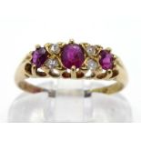 A ruby and diamond ring, the three principal oval cut rubies with rose cuts between, the shank fully