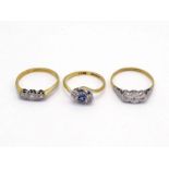 Three 18 carat gold and illusion set diamond rings, each with platinum settings, one set with a
