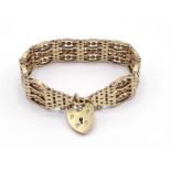 A 9 carat gold gate link bracelet, with a heart shaped padlock clasp, 36.3gms CONDITION: good