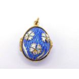 A silver gilt, diamond and enamel egg pendant, the blue guilloche enamel ground with applied white