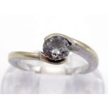 A single stone diamond ring, the central brilliant approx. 0.32 carat, the white mount (tests 18