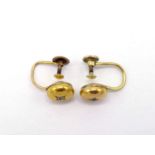 A pair of late Victorian gold and diamond ear studs, each circular stud gypsy set with an old cut