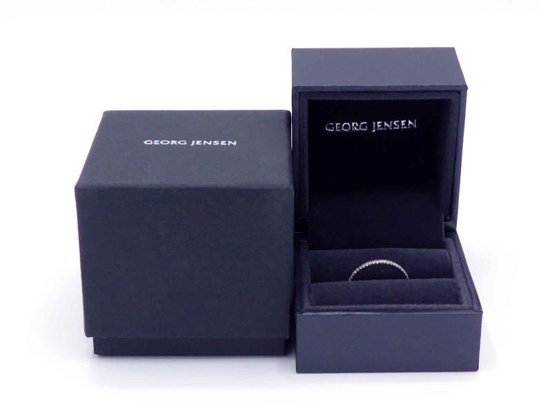 GEORG JENSEN, Aurora, a slim diamond and 18 carat white gold eternity ring, the small brilliants