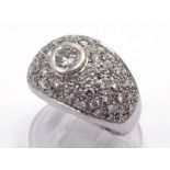 An Italian 18 carat white gold and diamond dress ring, the central brilliant approx. 0.26 carat, rub