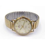 A 1950s gentleman's gilt metal automatic wristwatch by ENDACO, the gilt dial with applied Arabic