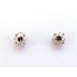 A pair of single stone diamond ear studs, each old brilliant cut stone approx. 0.57 carat,