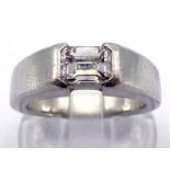A platinum and diamond single stone ring, the emerald cut approx. 0.95 carat, rub over set, fully