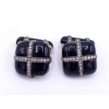 A pair of diamond and onyx cufflinks, the square cushion shaped links with a central pave set