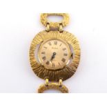 Vendome, a 1970s gilt metal dress watch, the circular gilt dial with black Roman numerals and