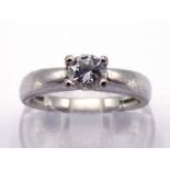 An 18 carat white gold and single stone diamond ring, the brilliant cut approx. 0.45 carat, claw