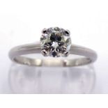 A single stone diamond ring, the central brilliant approx. 0.59 carat, in a platinum mount, fully