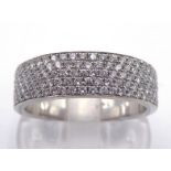 A diamond half hoop ring, the broad band two thirds pave set with small brilliants, the white