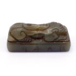 A Chinese carved jade seal modelled as recumbent tiger, signed on one side "Daqian Zhang", 7.5cm