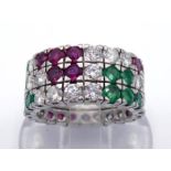 A ruby, emerald and diamond ring, a three row grid pattern of pave set round cut emeralds, rubies