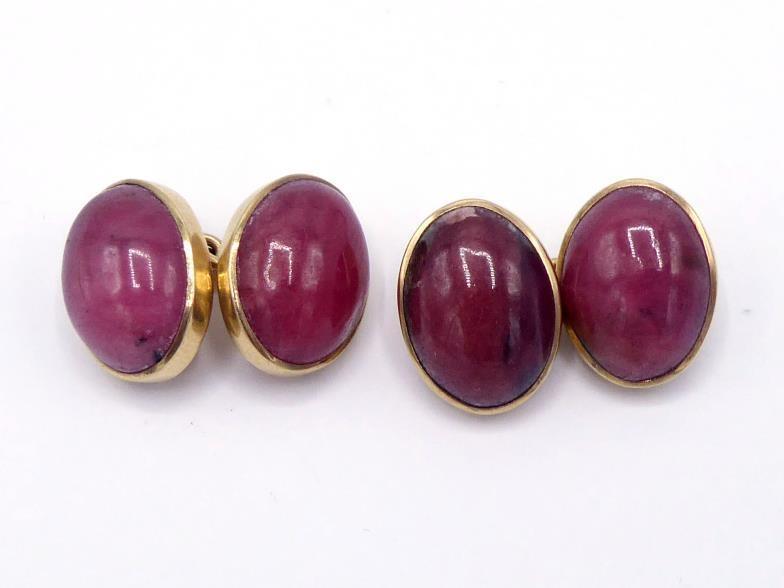 A pair of 9 carat gold and rhodonite cufflinks, the oval 16mm long cabochons rub over set, to