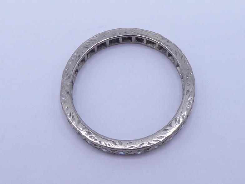 A 14 carat white gold and diamond eternity ring, composed of pave set single cuts, the band import - Image 2 of 2